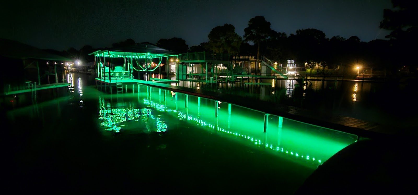 Dock and water lit green