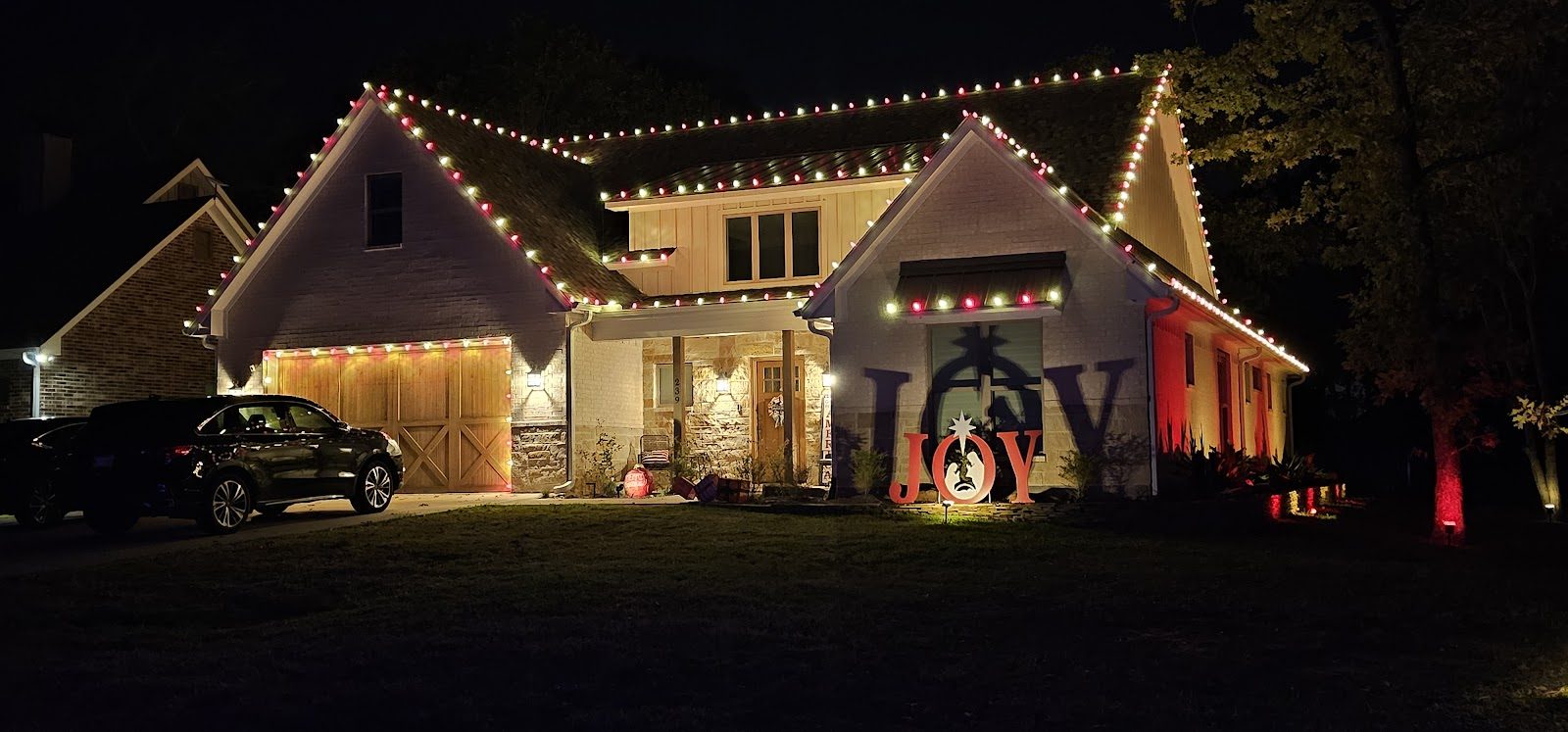 Home with Christmas lighting and yard decor